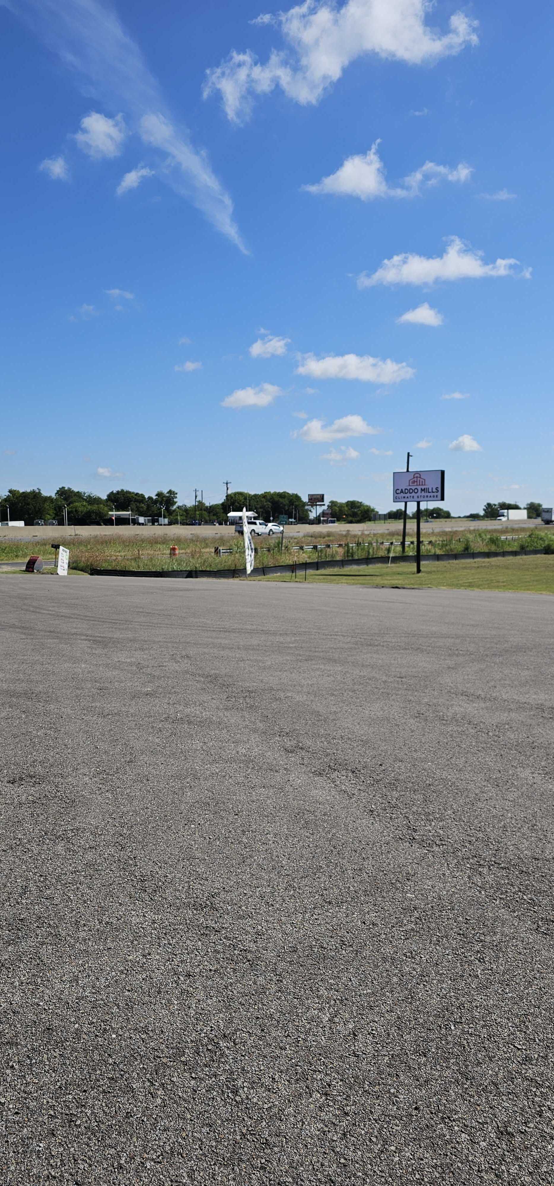 Caddo Mills Climate Storage β Convenient Self Storage for Outdoor Hobby Gear in Texas Caddo Mills Climate Storage facility sign along the highway under a clear Texas sky